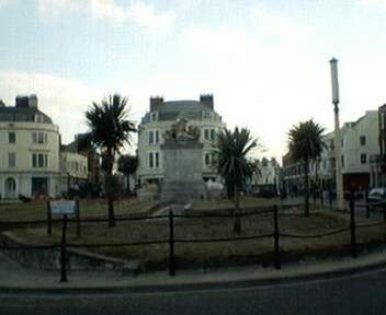 The statue of King George III standing by the seafront at the junction of St. Mary and St. Thomas Street, Weymouth, Dorset